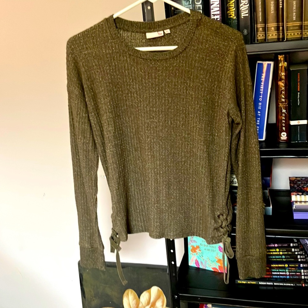 Olive green sweater with cute strings at the bottom of both sides